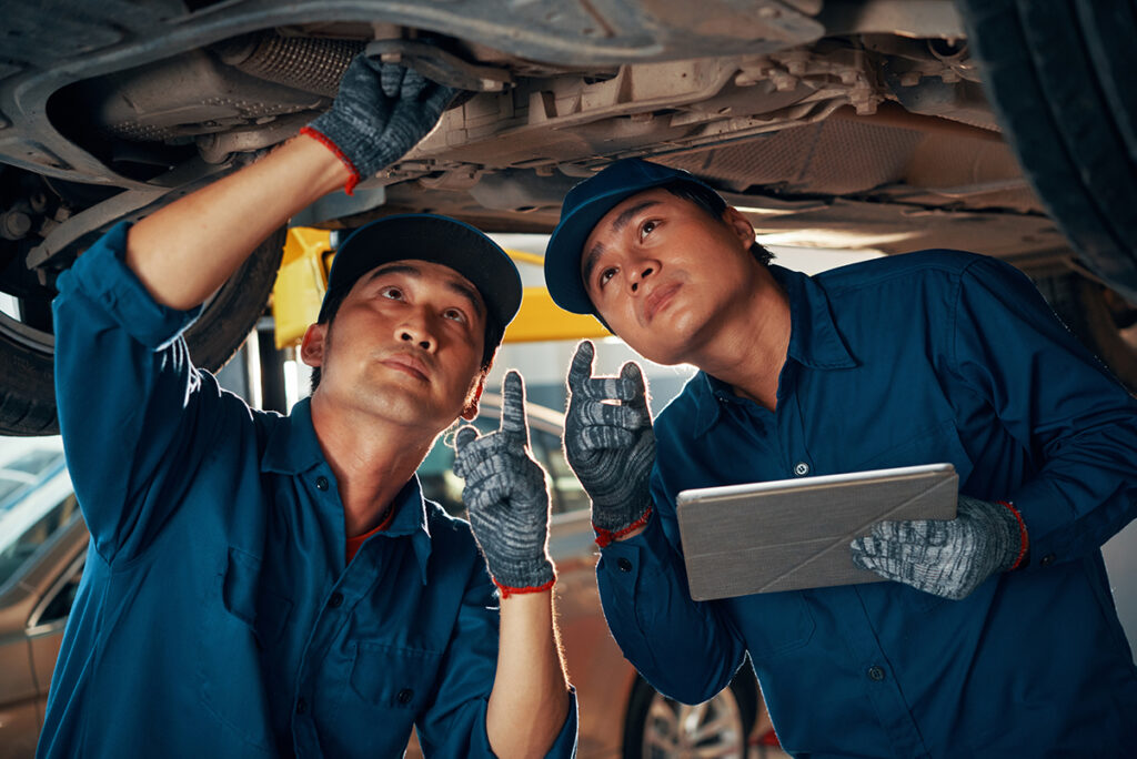 mechanic examines