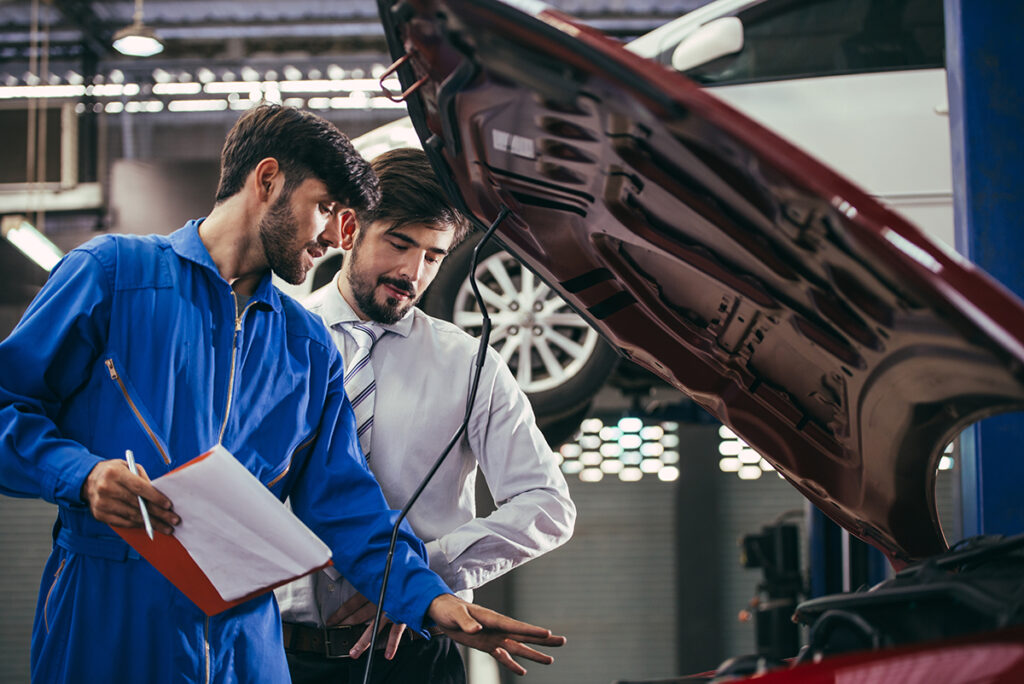 auto mechanic explaining