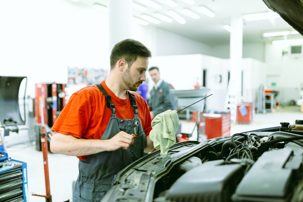 Car mechanic upkeeping car