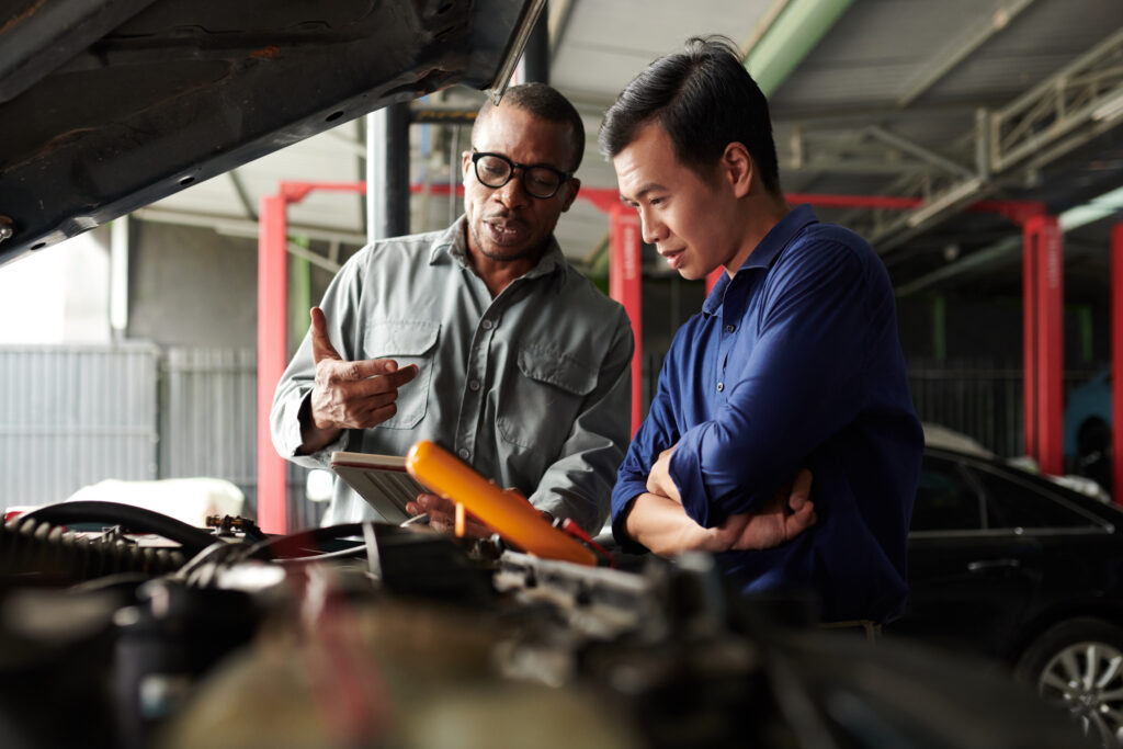 car_mechanic_talking_to_owner