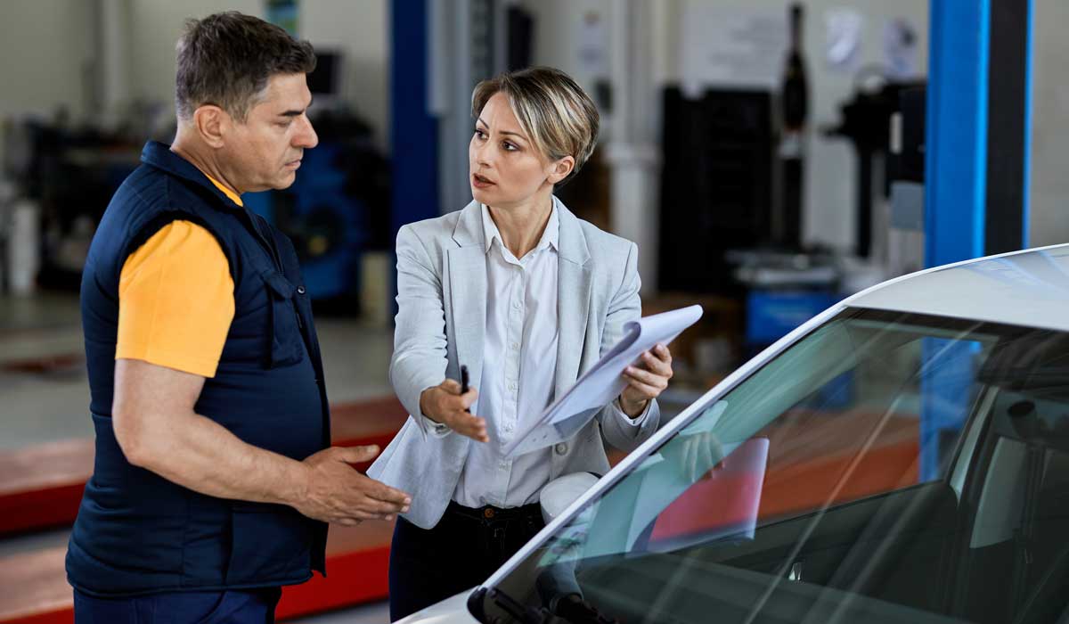 car_mechanic_talking to lemon_law attorney