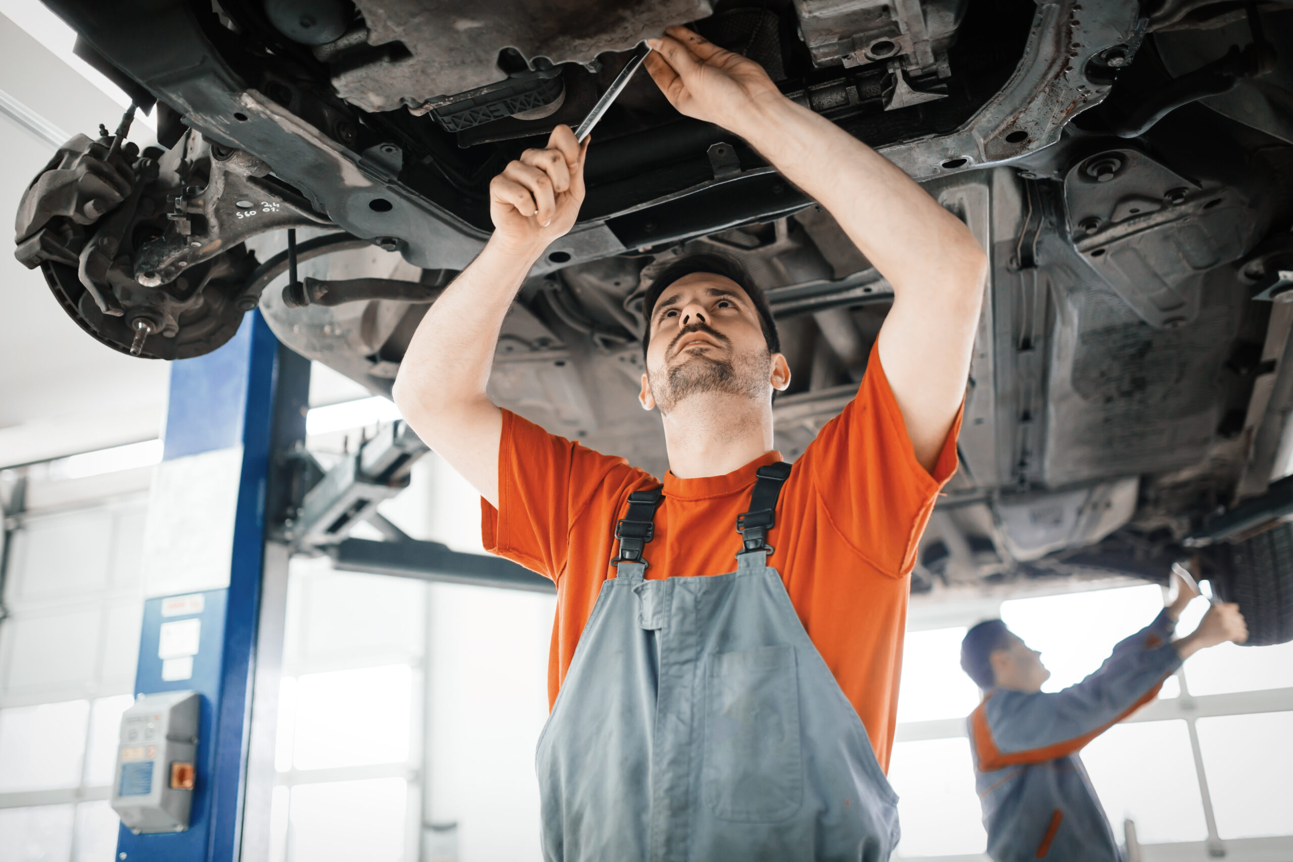 car-mechanics-working-and-maintaining-car