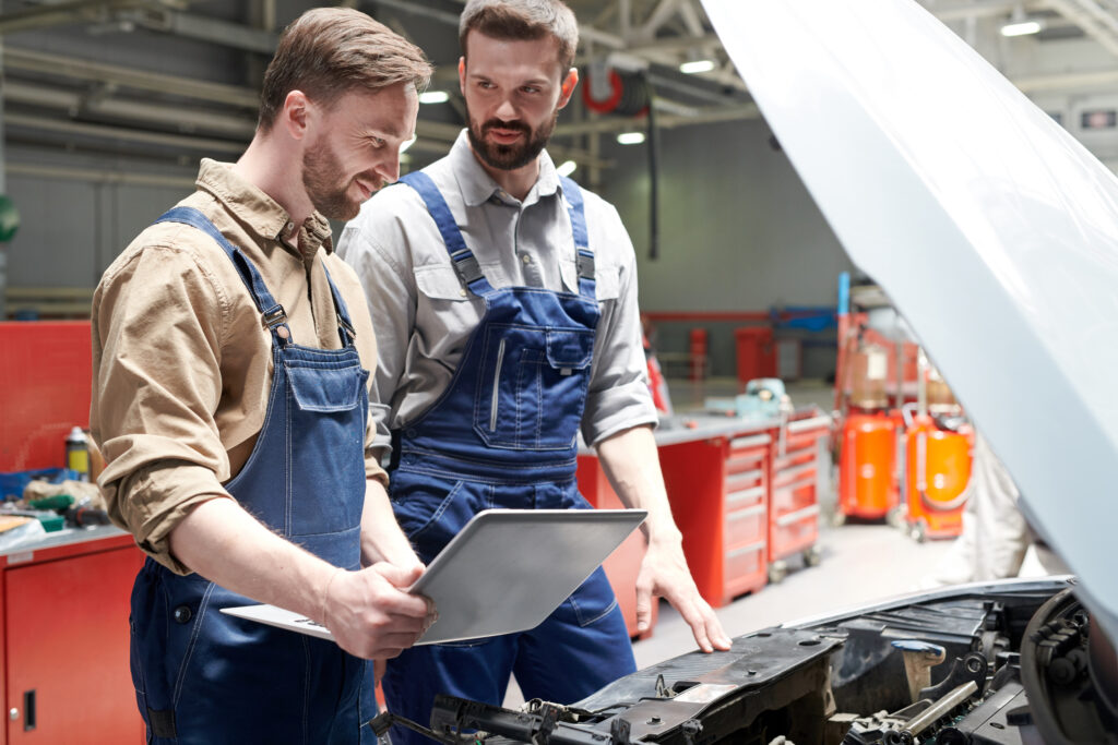 two-mechanics-repairing-car